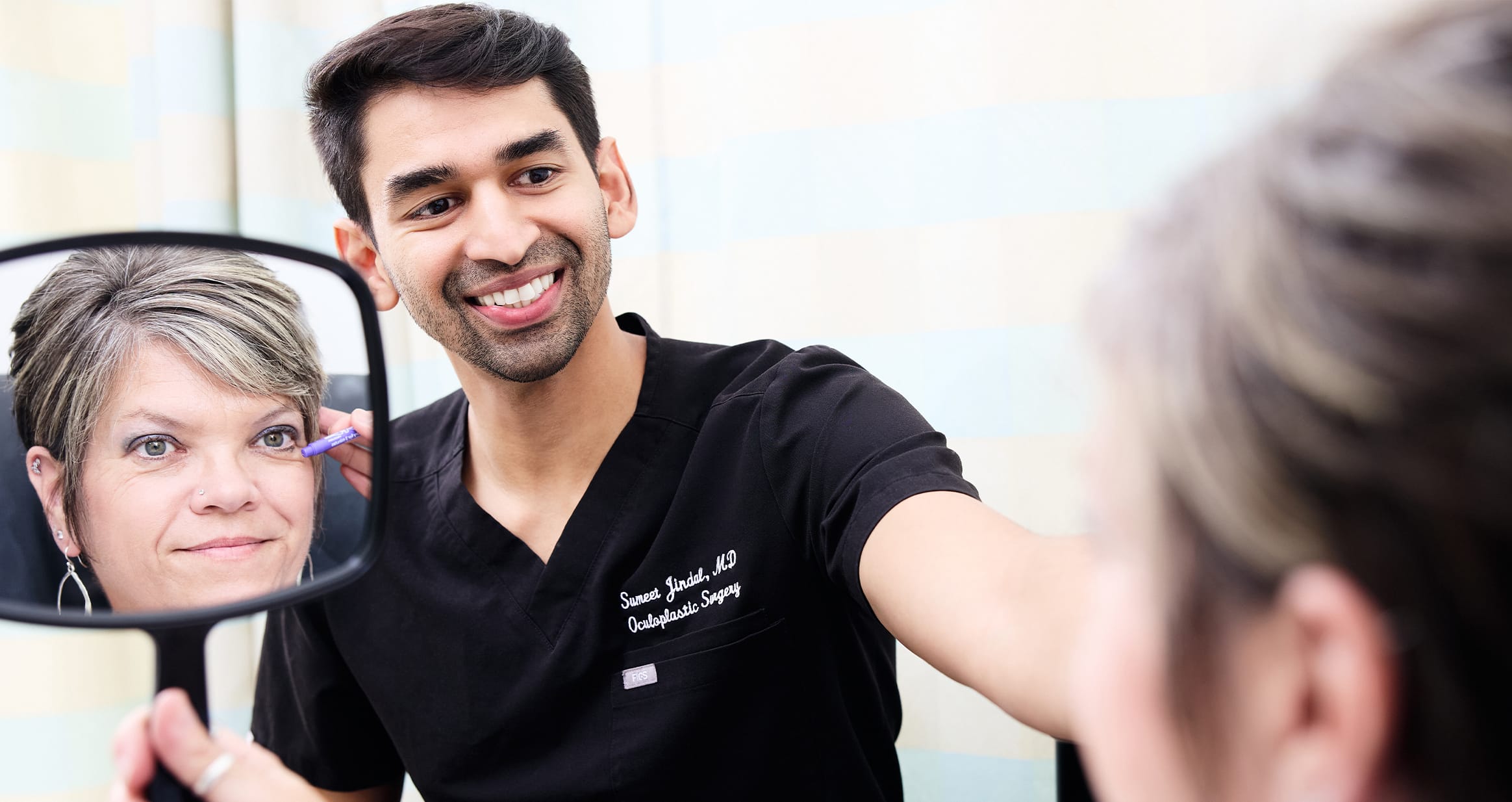 Patient looking into mirror