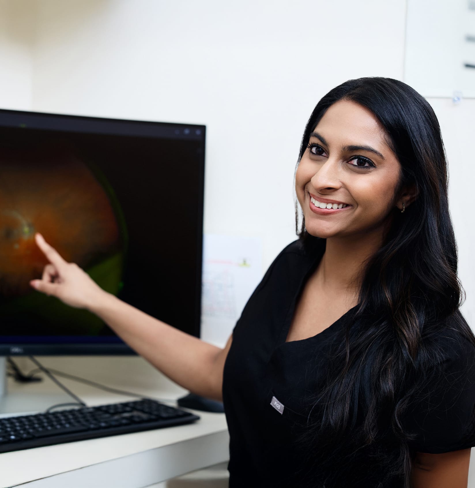 Doctor pointing to a screen
