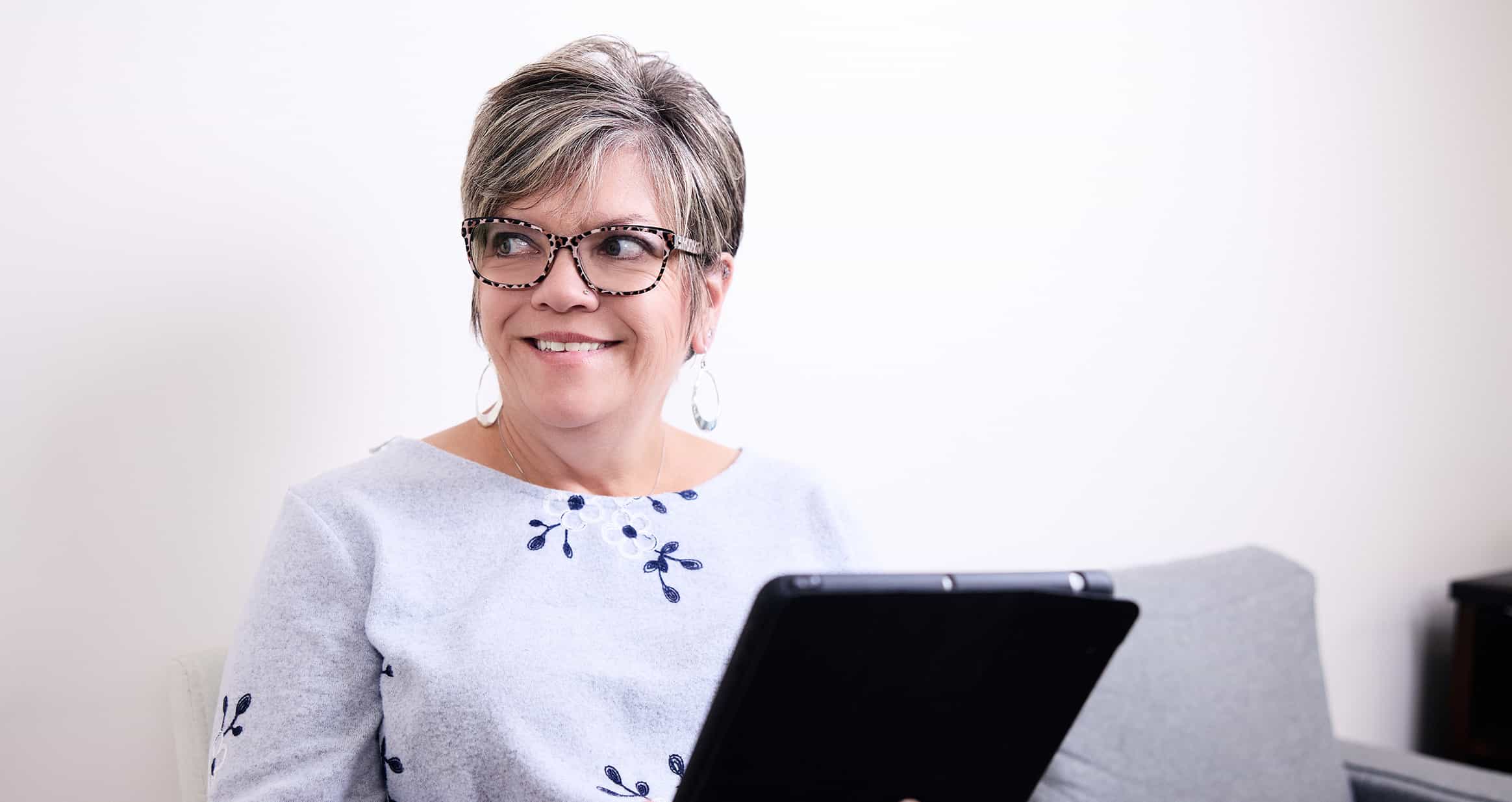 Woman smiling with clipboard